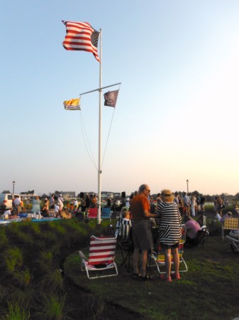 Children eagerly awaiting the arrival of their ducks at the near the finish line Friday evening at the an