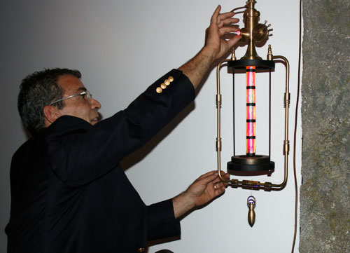 Art Donovan demonstrates the dimmer function on one of his steampunk lights.