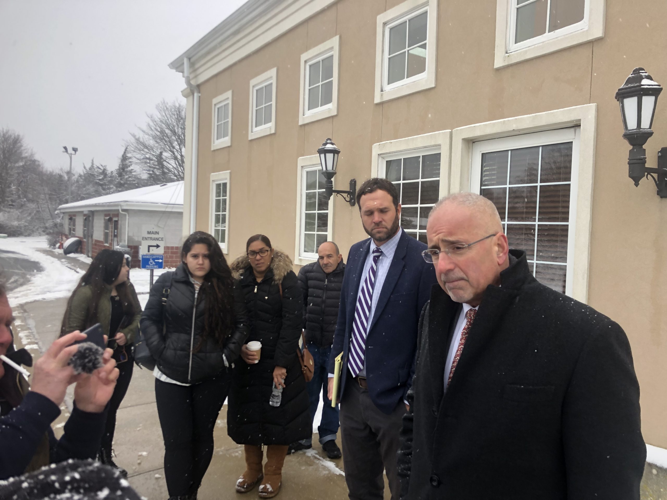 Lisa Rooney's attorneys, Marc Gann, right, and Chris Carillo made a statement about the case on Wednesday morning with friends of John James Usma-Quintero looking on. 