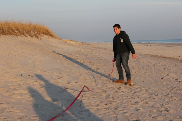 Westhampton Beach High Schooler Thomas Montagna gathers with a group of his friends as well as his Boy Scout Troop 62 to clean up Rogers Beach as part of his Eagle Scout project. COURTESY PAUL MONTAGNA