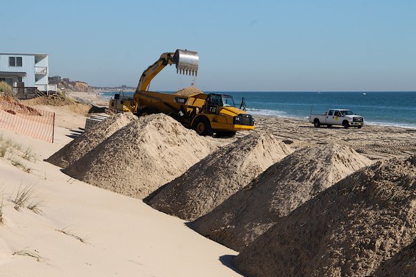 Many are angered by the construction that began this week on a stretch of Montauk shoreline. The Downtown Montauk Emergency Stabilization Project will result in a revetment of large sandbags covering the beach. KYRIL BROMLEY