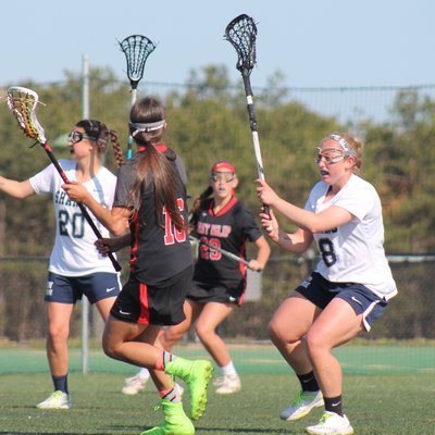 ESM's Victoria Friedel plays defense on East Islip's Alexa Mattera. KERRY MONACO