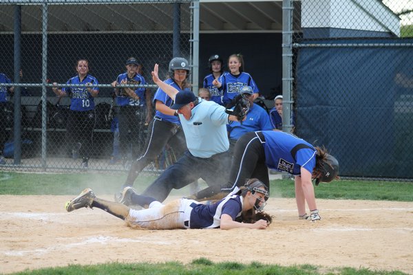 Lady Shark Marissa Rizzi gets into a collision at the plate. KERRY MONACO
