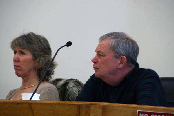 Town Board members Theresa Quigley and Pete Hammerle listened to comments from taxi industry representatives on Saturday.