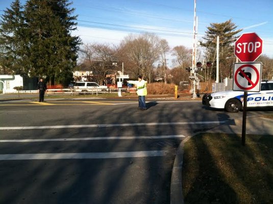 East Hampton Village Police reroute traffic after a small fire at East Hampton Cleaners on Wednesday