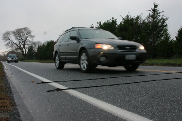 Rubber counters laid across roadways have been tracking the number of cars using local roads this fall as part of a state project. MRW