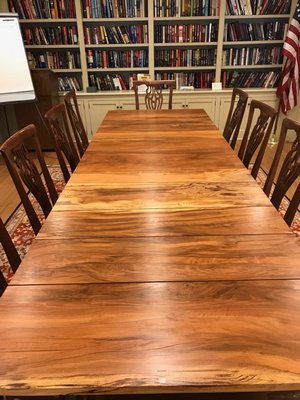  but local woodworker Tom Matthews salvaged several of the branches and made them into a large table that now resides in the conference room in Cooper Hall.