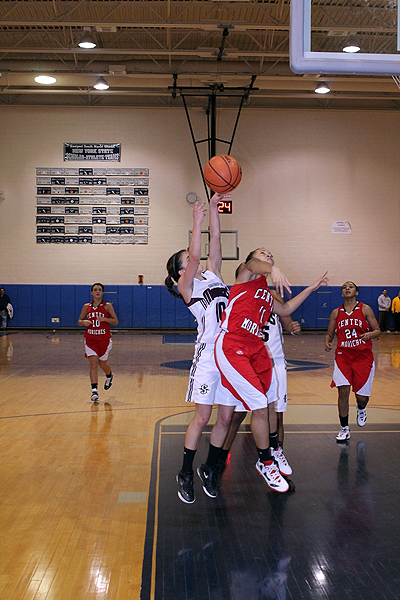 Lady Red Devil Takia Plummer attempts to stop Southampton's Carley Guida on her way to the hoop.    KERRY MONACO