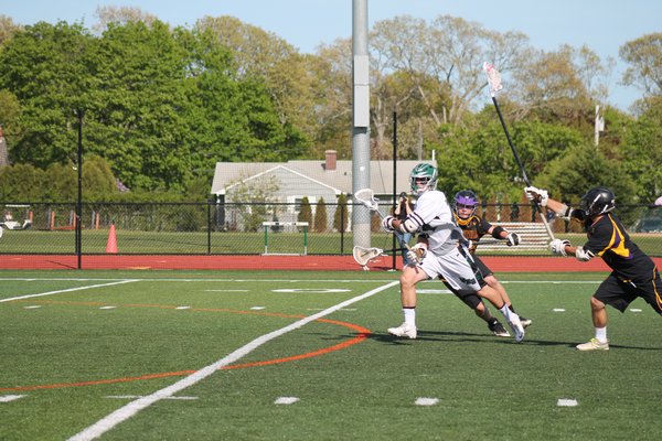 Evan Gagne heads to goal against Sayville. BY KERRY MONACO