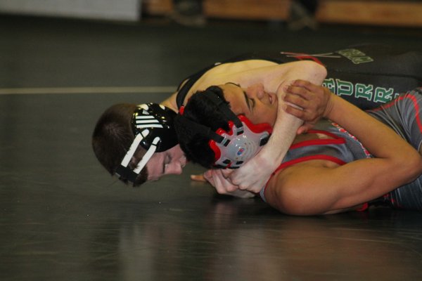 Casey Hughes (113 pounds) pinned his Amityville opponent in second period. KERRY MONACO