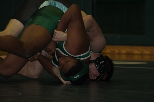 Dane Mendoza pinned Alex Millwater at 113 pounds in the match against Sayville. KERRY MONACO