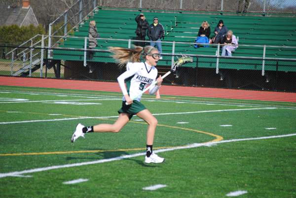 Sami Vickers sprints down the field.
