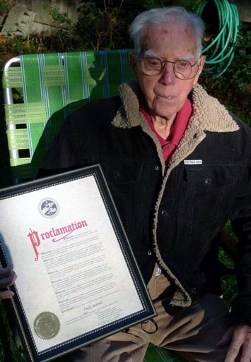 Paul Miano with proclamation by the
Town Board honoring him on his 100th
birthday. PETER BOODY