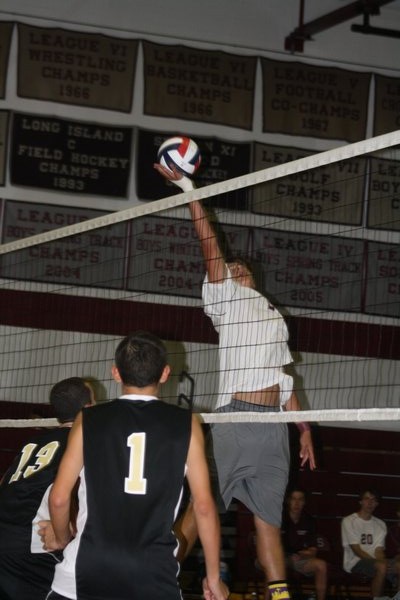 Pete Shilowich tries to tip the ball over the net. CAILIN RILEY