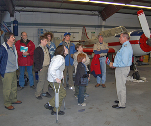 The Scouts and Pilot Spence inside the Mid Island Air hangar. BRENDAN O'REILLY