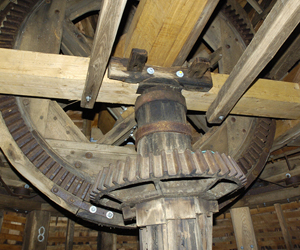 The gears inside of the windmill.