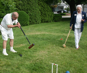 Jonathan Holding plays a round of croquet at the Westhampton Mallet Club's 50th Anniversary Celebration on Saturday on the Village Green. JESSICA DINAPOLI