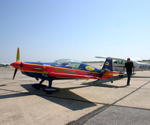 Stunt Pilot Mike Mancuso with an Extra 300L in the foreground and a Cessna 172 in the background. JESSICA DINAPOLI