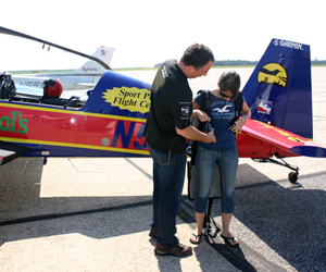 Stunt Pilot Mike Mancuso and reporter Vera Chinese prepare for take-off in an Extra 300L. JESSICA DINAPOLI