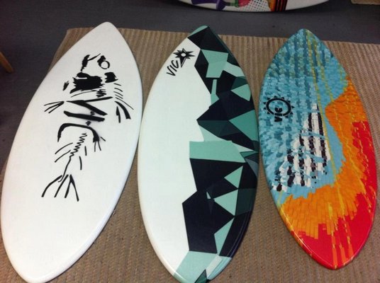 Surfboards with original artwork by Alyx Tortorice.