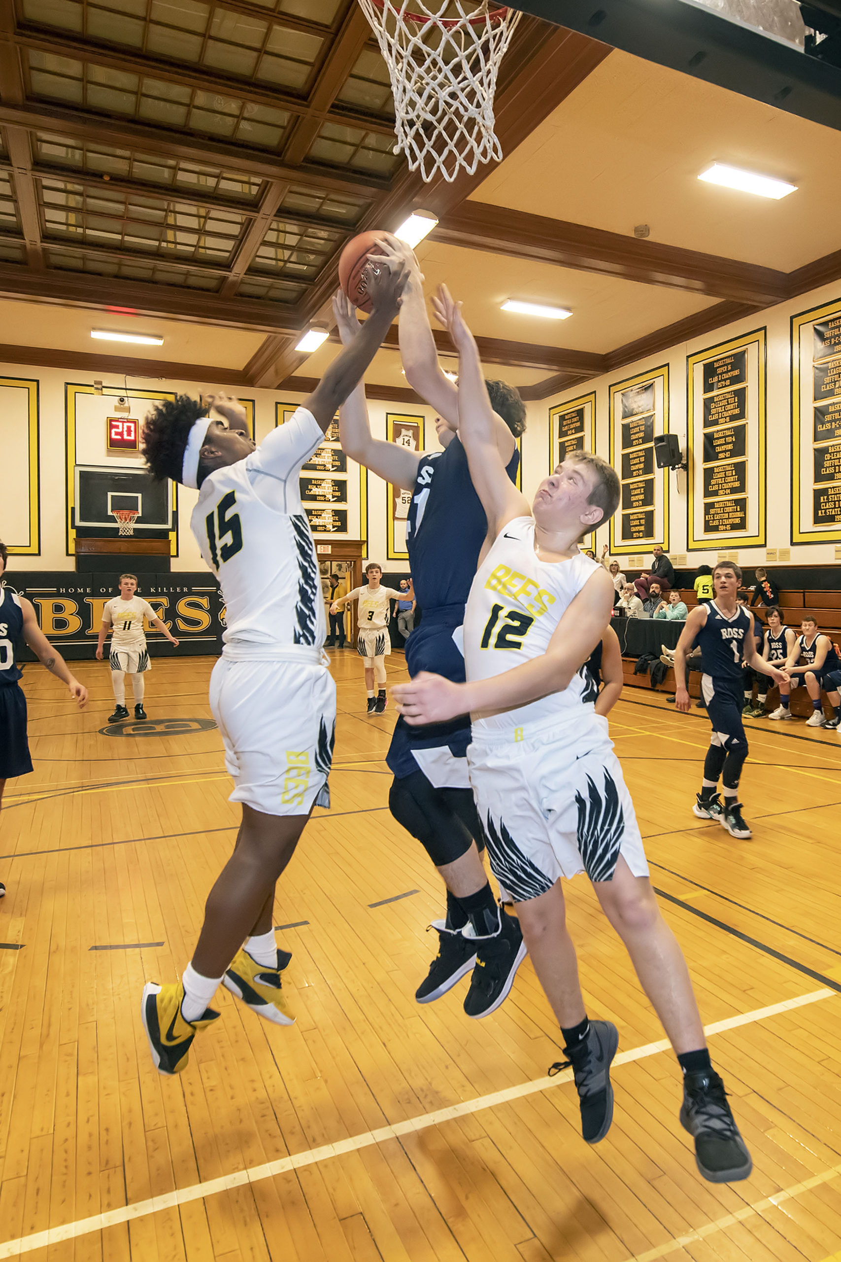 Bridgehampton's David Simms and Jack Boeshore fight for a rebound.