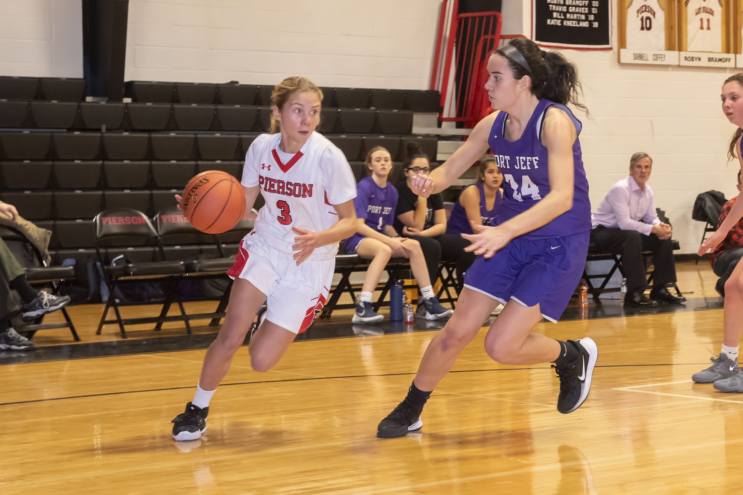 Pierson's Brooke Esposito takes on a Port Jeff defener one-on-one.