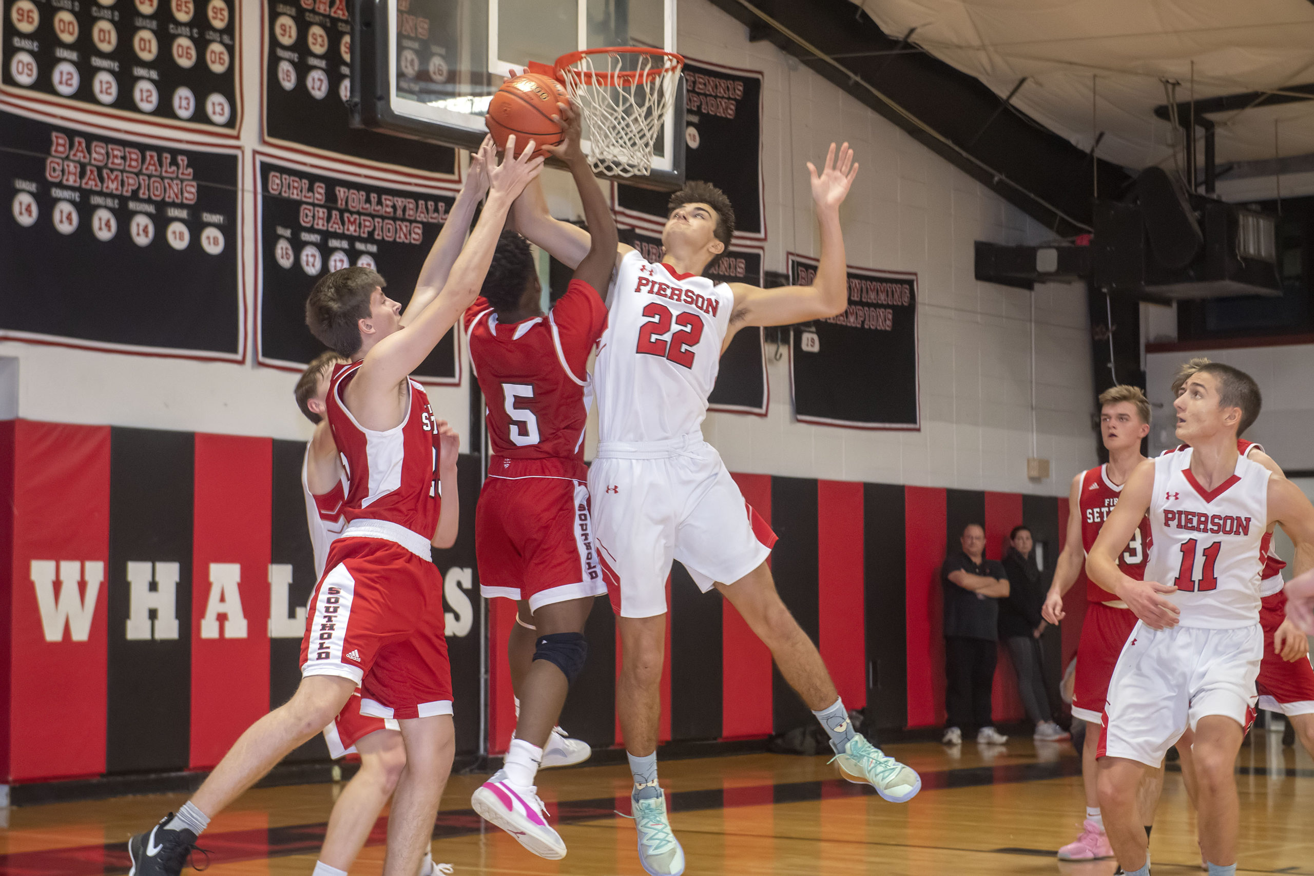Pierson's Harry Cowen denies a Southold player at the hoop.