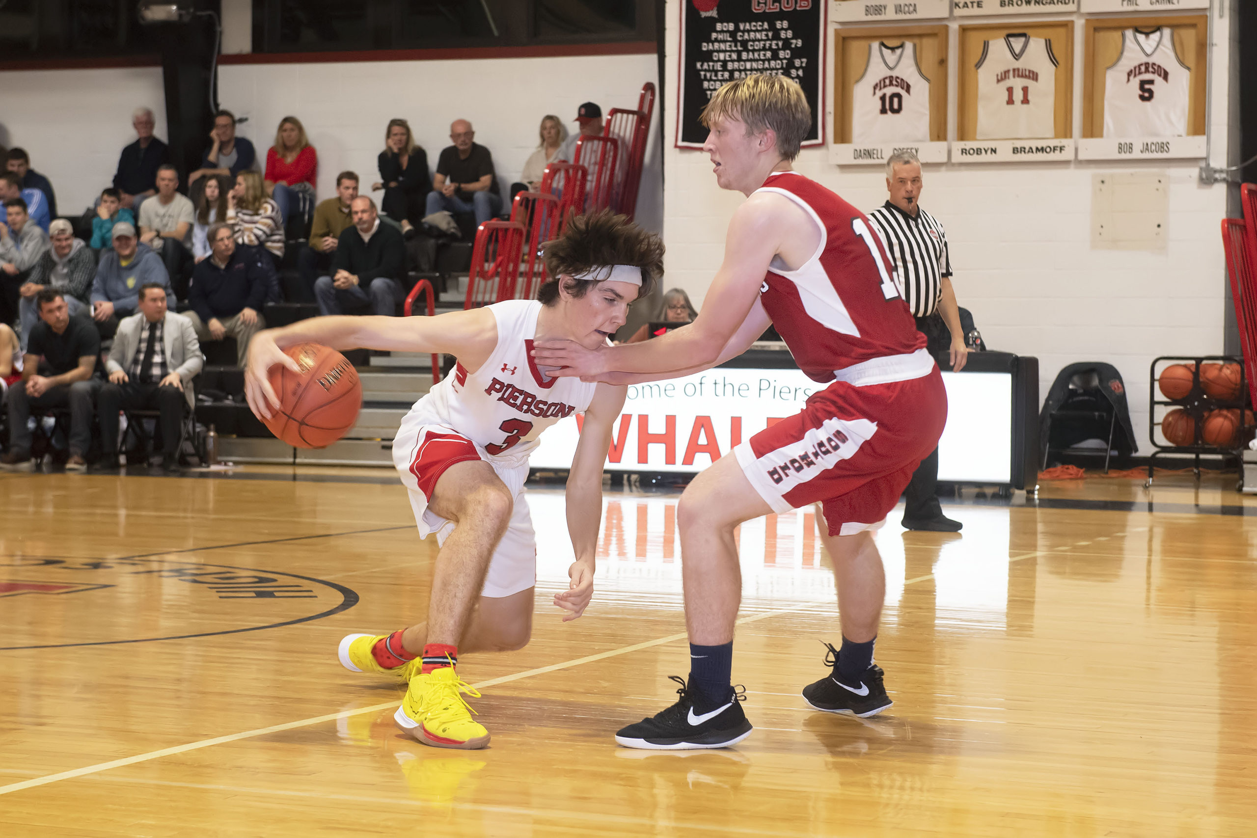 Pierson senior Henry Brooks goes to crossover a Southold defender.
