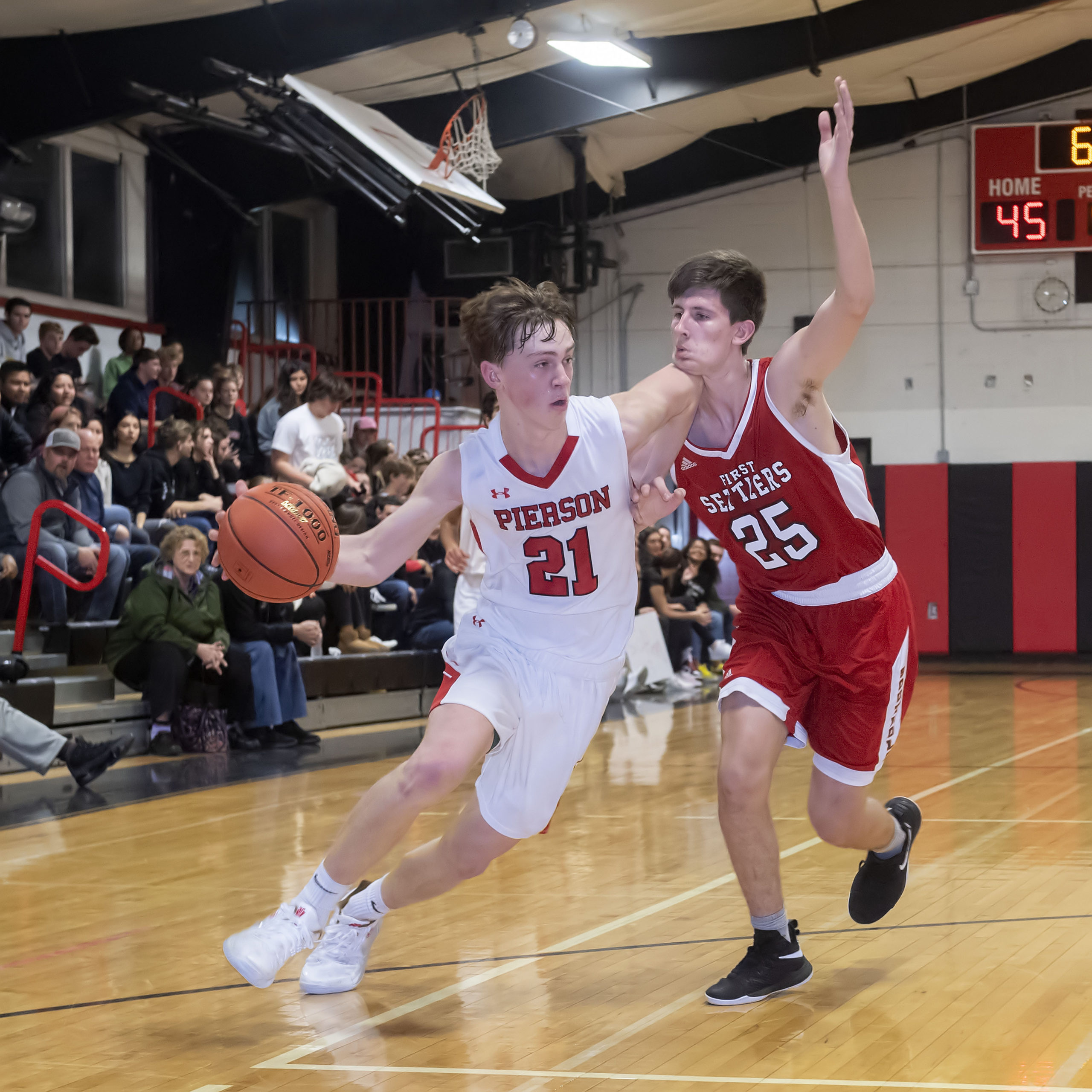 A Southold defender takes an inadvertant elbow to the chin from Pierson's Wilson Bennett who is driving to the basket.