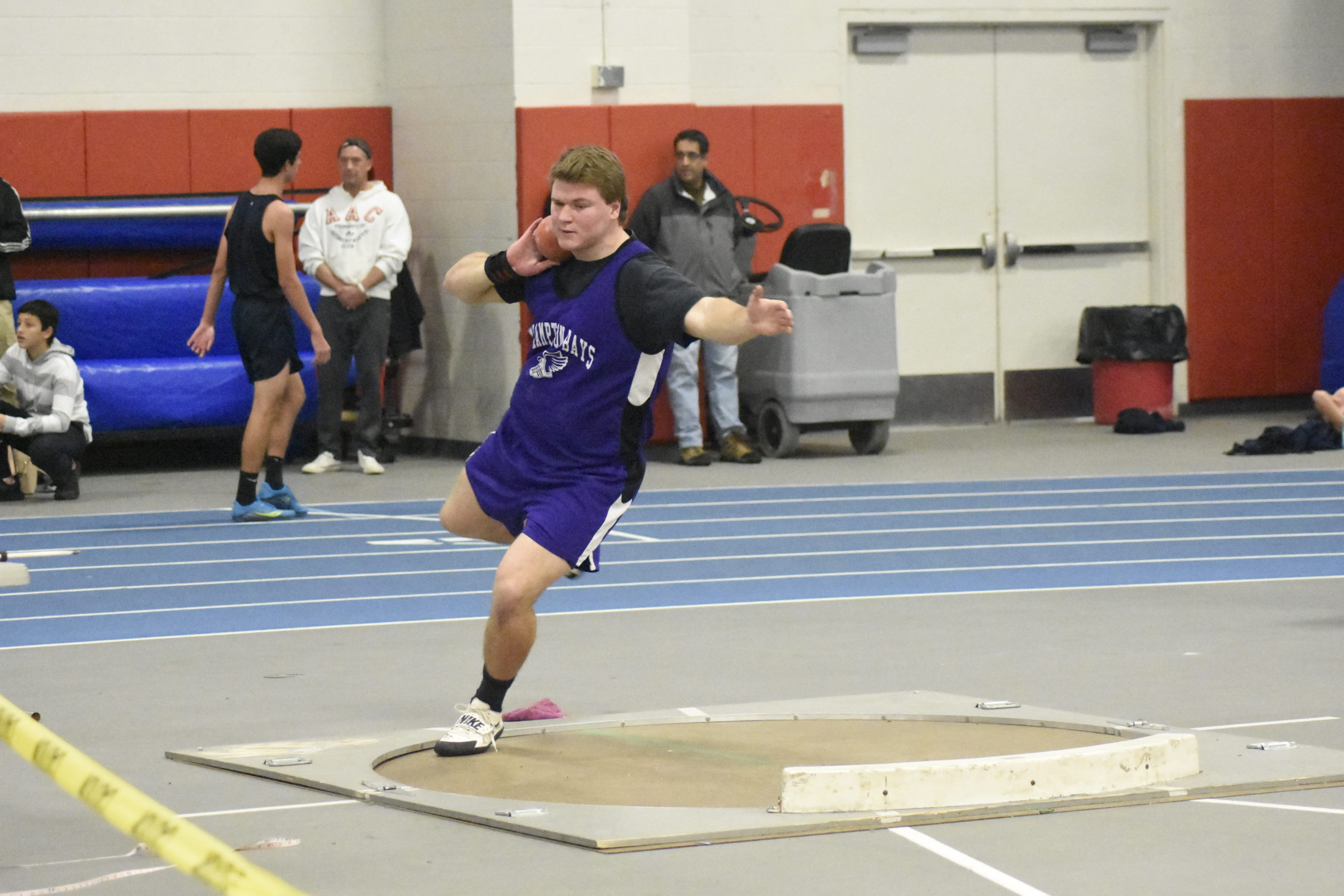 Hampton Bays senior Quinn Smith gets set to throw a personal best 55 feet 2.5 inches in the shot put.