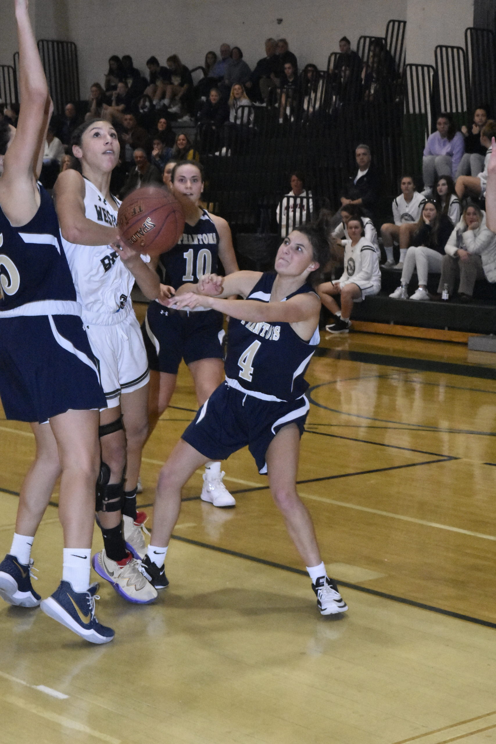 Westhampton Beach senior Layla Mendoza takes down a few Bayport defender down low in the paint.