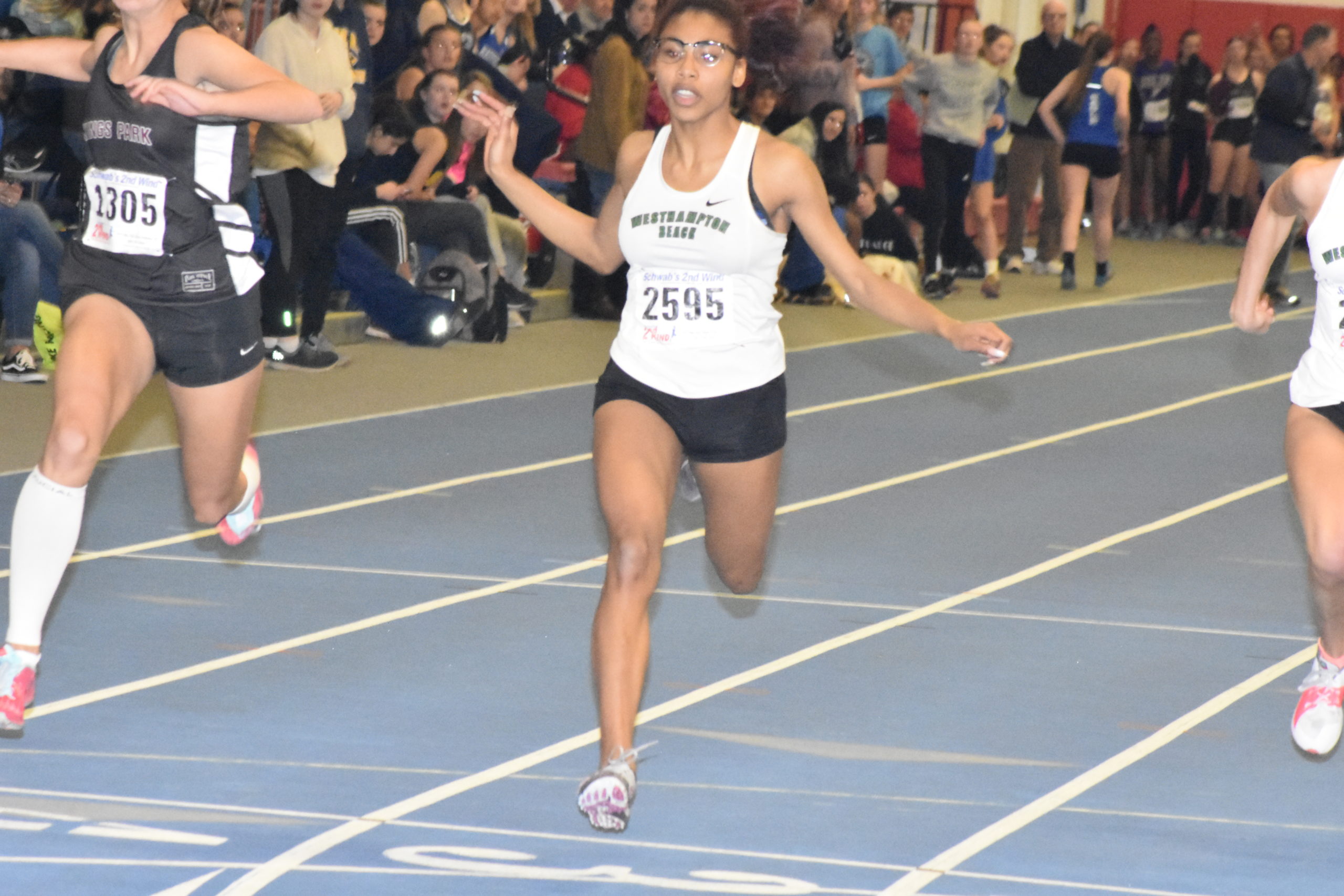 Oceane Ode crosses the finish line in the 55-meter dash.