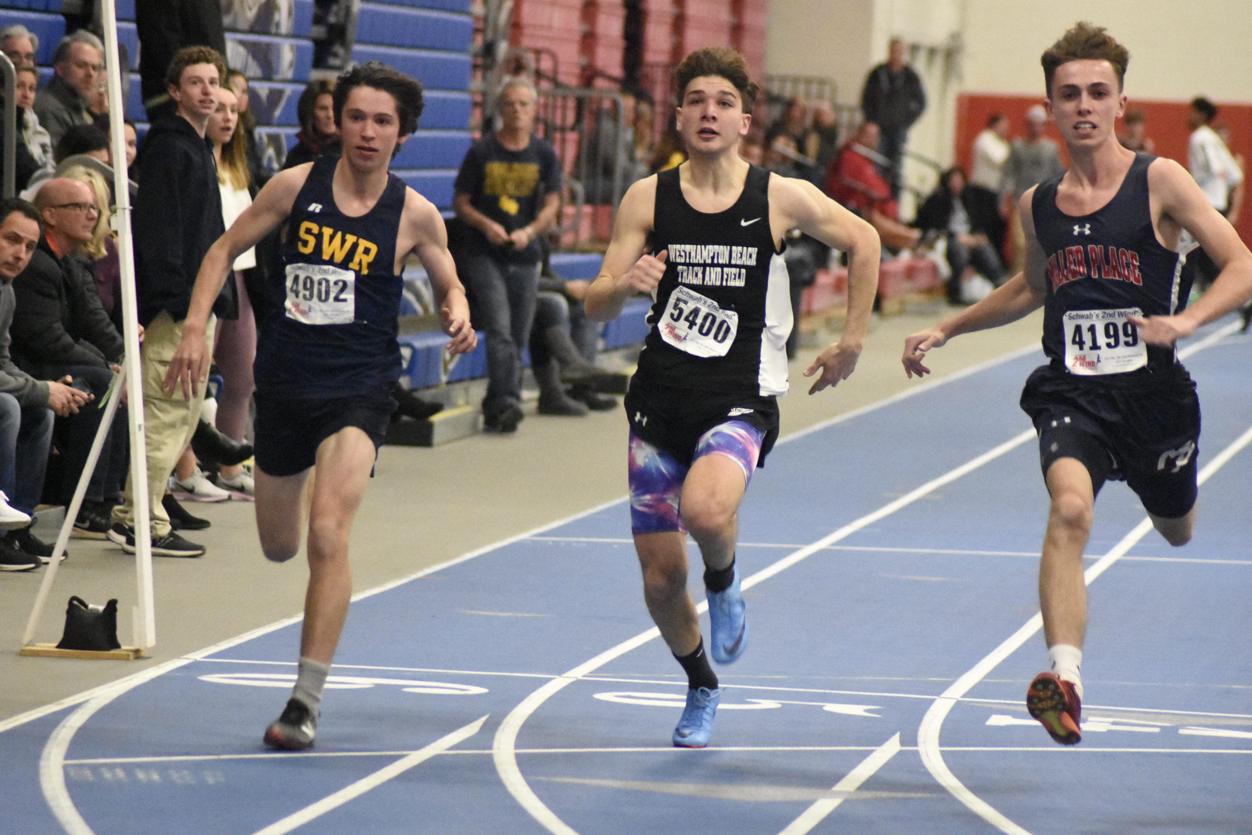 Bobby Ditta crosses the finish line in the 55-meter dash.