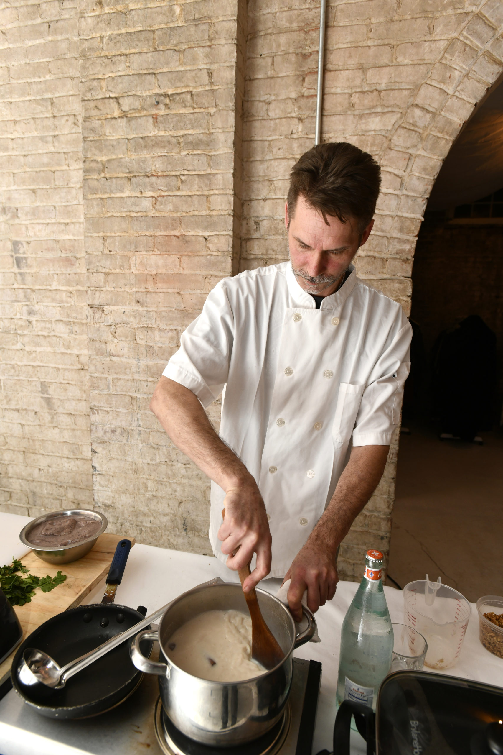 Chef Jon Albrecht prepares a dish at a class at The Spur in Southampton.