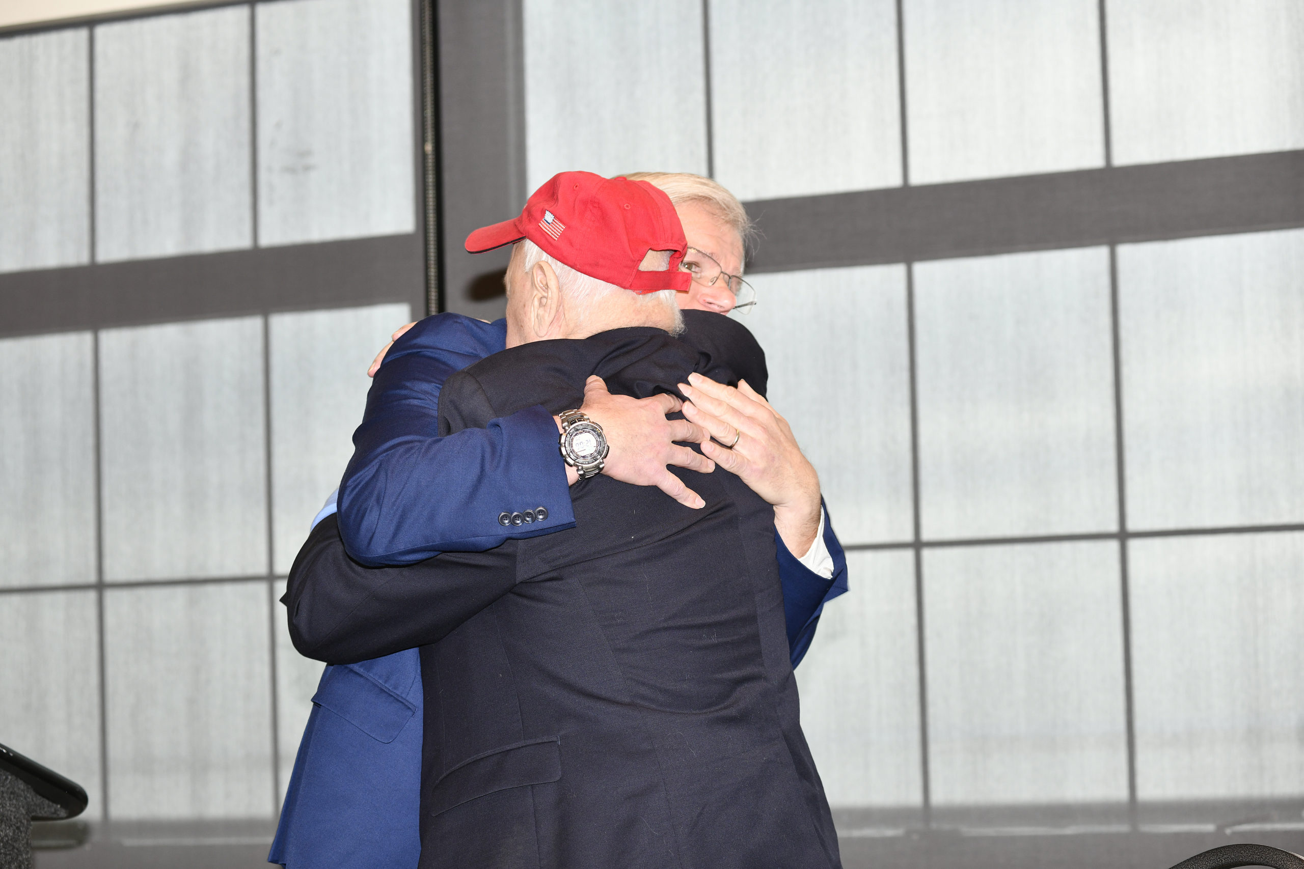 An emotional Fred Thiele hugs Kenneth Lavalle at the announcement on Friday that the Senator will not be seeking reelection. DANA SHAW