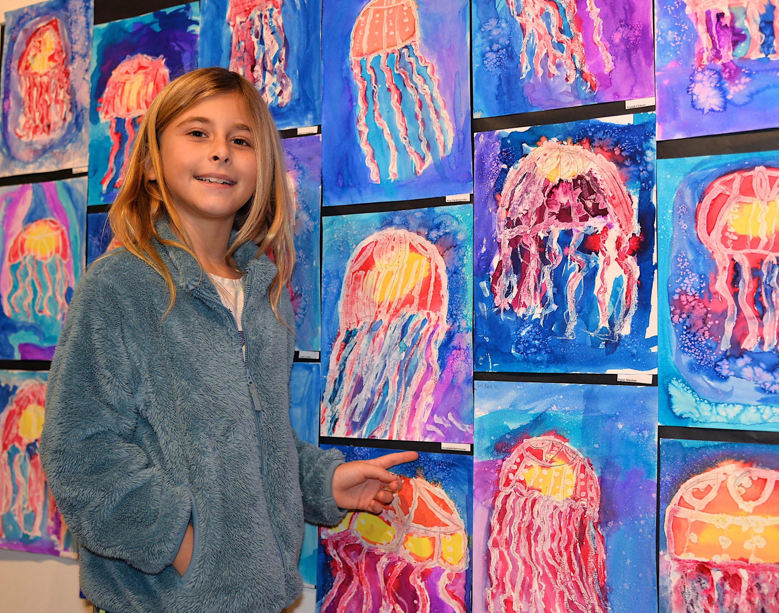 The Student Arts Festival opened at Guild Hall on Saturday with a reception. John Marshall Elementary School second-grader Annabelle Mahmouzian points to her work. KYRIL BROMLEY