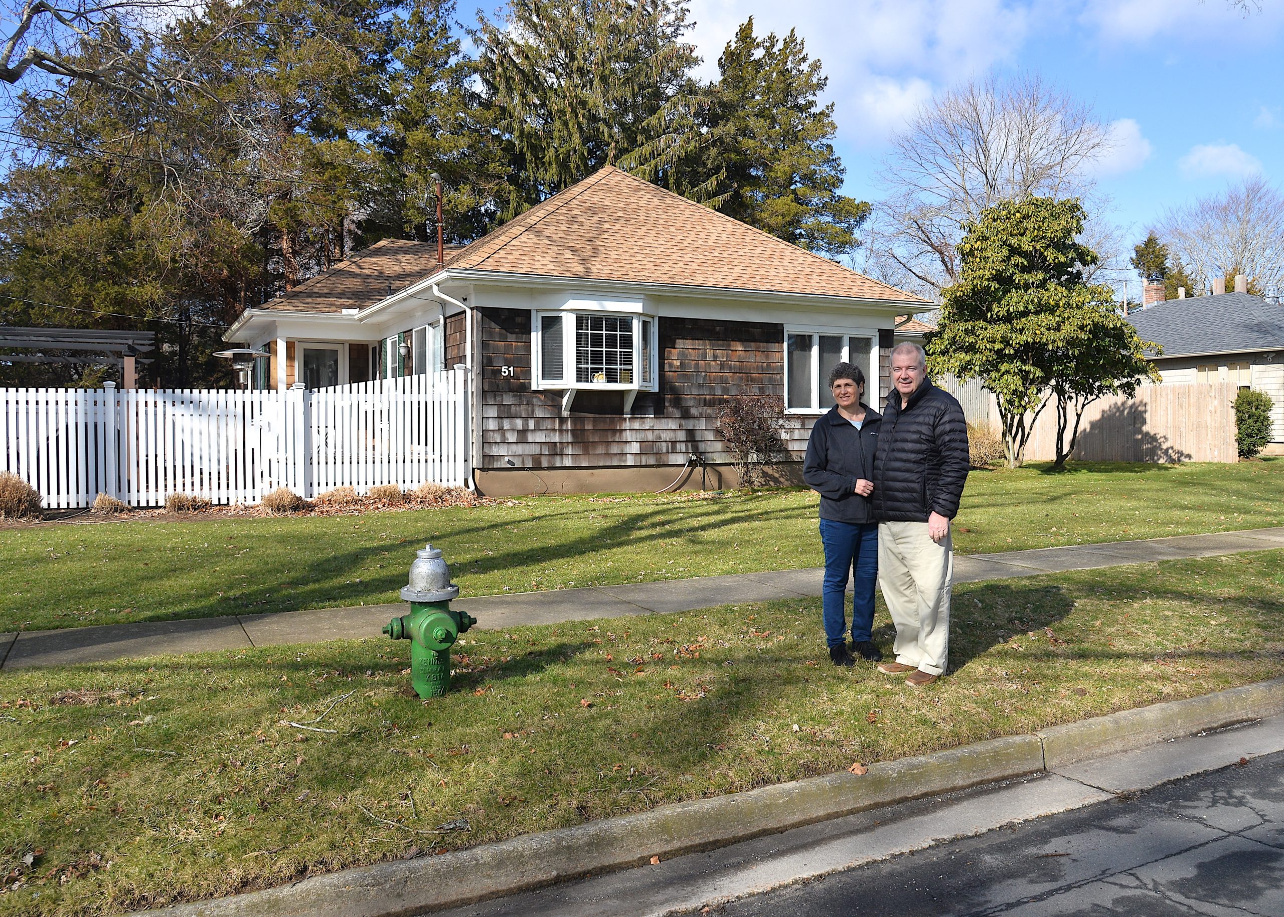 Yvonne and Daniel Ujvari stand where the riser pole would go in front of their home.  KYRIL BROMLEY