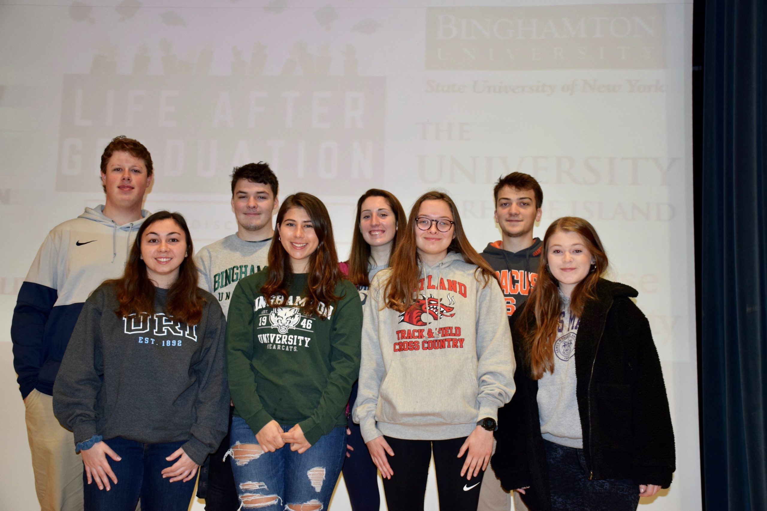 Eighth-graders at Hampton Bays Middle School learned about a variety of colleges from visiting Hampton Bays High School alumni during the middle school’s 12th annual College Awareness Day. Back row, left to right, Sean Noonan (Penn State University), Thomas O’Connell (Binghamton University), Bridget Hughes (University of South Carolina) and Jared Strecker (Syracuse University), front, Sarah Fassino (University of Rhode Island), Christina Coulton (Binghamton University) Maryrose O’Connell (SUNY Cortland), and Meghan Long (James Madison University).