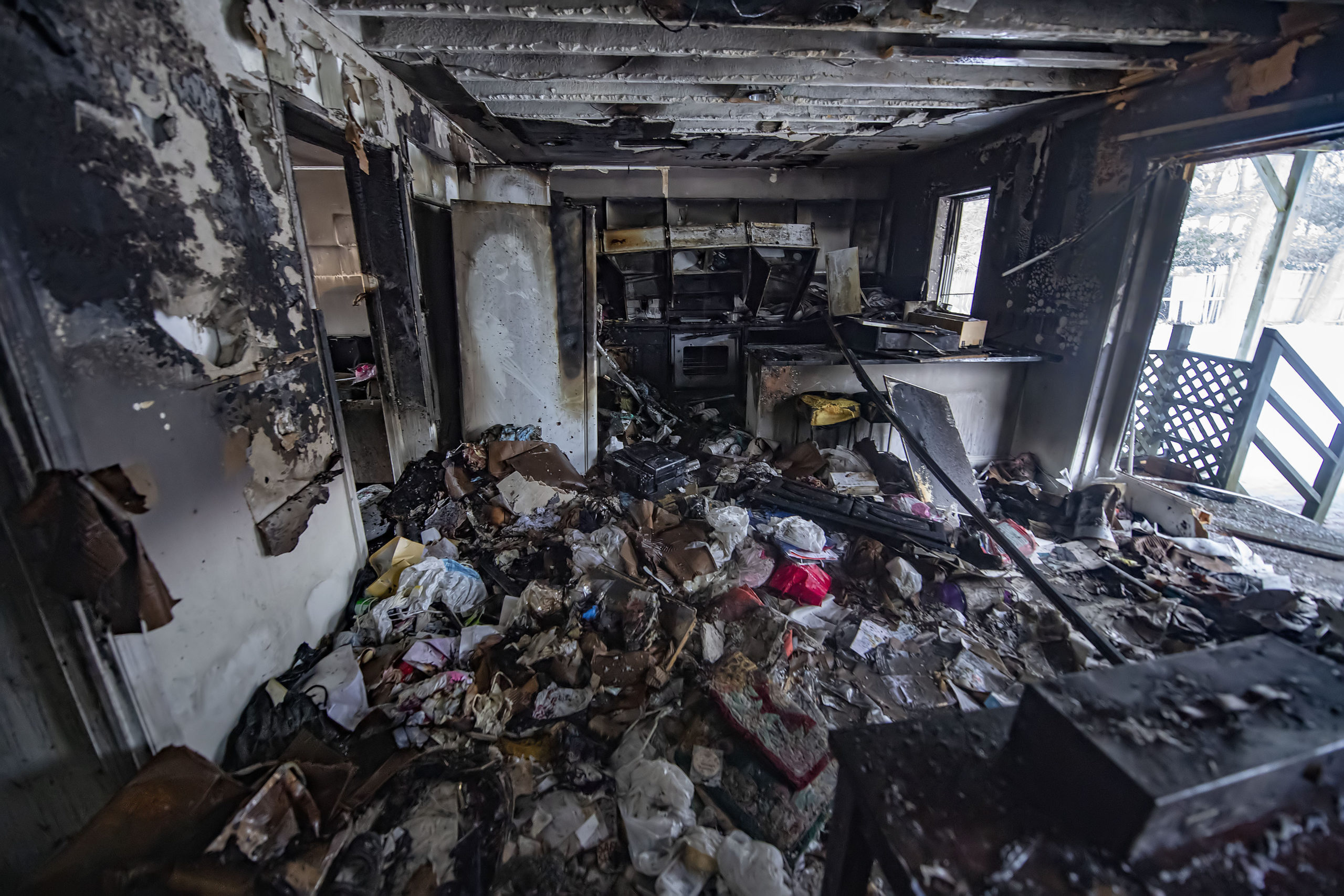 A view inside the kitchen area inside the residence following the working house fire at 38 Cove Hollow Road in East Hampton on Saturday.  MICHAEL HELLER