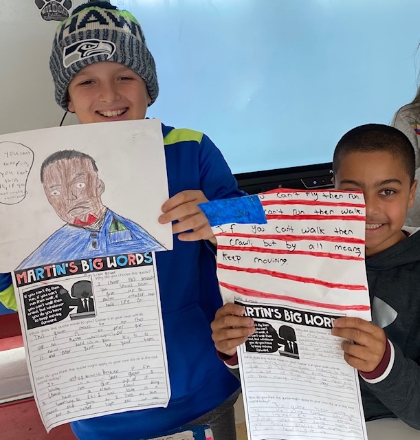 Liam Brand and Nic Simone show off the projects they created to celebrate Martin Luther King Jr. Day . They researched his words and were guided by “Only love drives out hate.” 