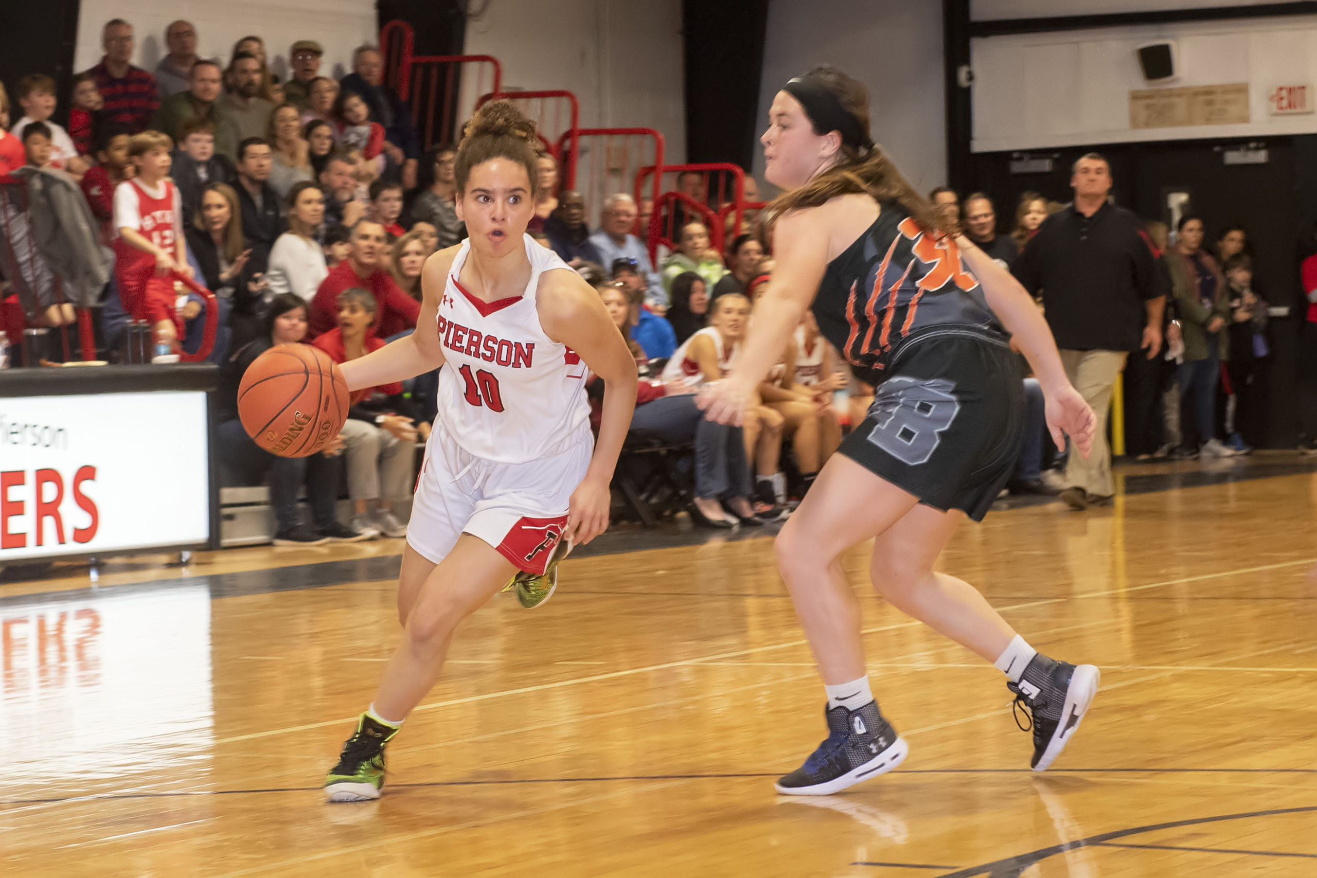 Pierson's Chastin Giles looks for a lane to drive as she gets passed a Babylon defender.