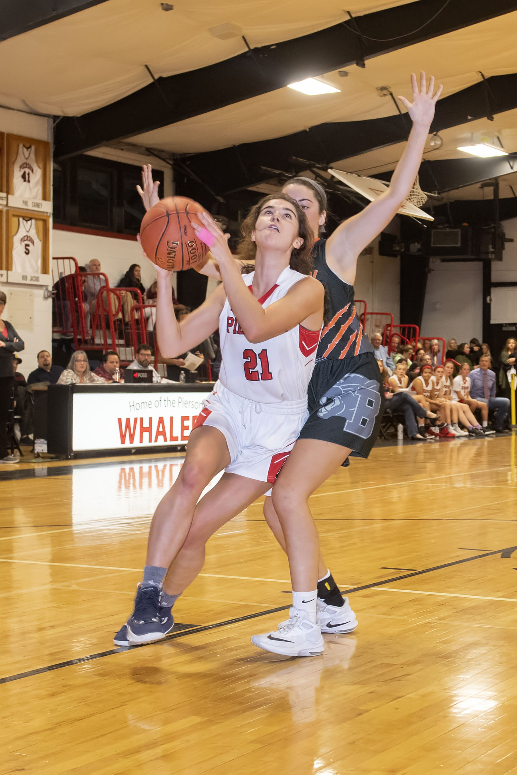 Lady Whaler Meredith Spolarich gets an inside advantage on a Babylon defender and scores.