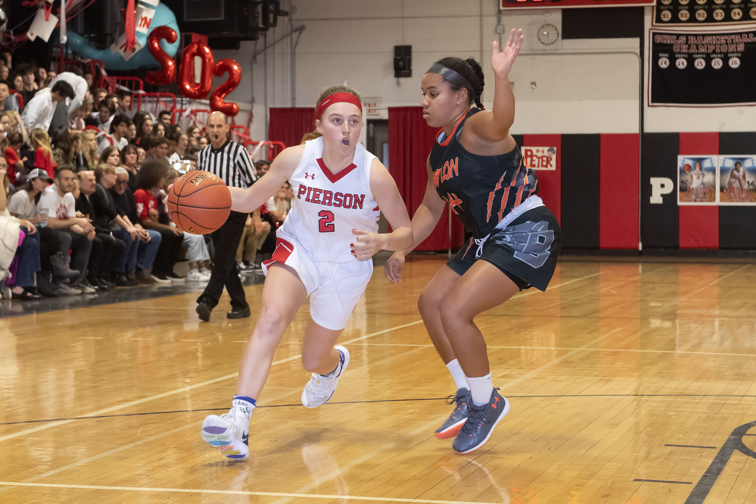 Pierson's Grace Perello drives on Babylon's Emma Ward.