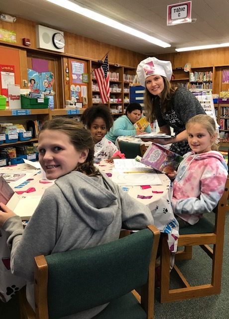 Students in grades three to five at Westhampton Beach Elementary School rang in the new year by exploring new books during a “book tasting” event cooked up by school librarian Joy Campagna. As an authentic touch, the school’s library was transformed into a restaurant, complete with artificial candlelight, classical music and a menu featuring a variety of book genres. Students were encouraged to “taste” new books and take one home to devour.