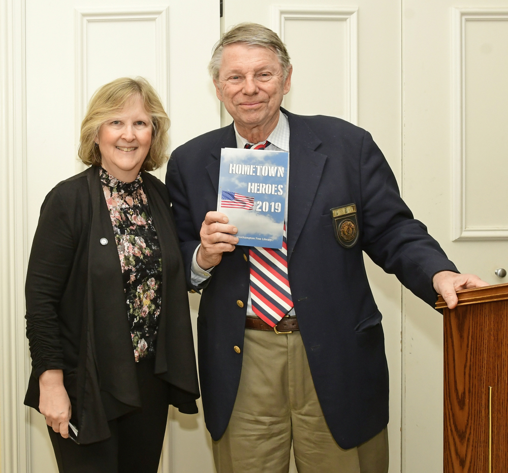 Susan Berdinka, technical services librarian at the Westhampton Free Library, presented Commander Thomas Hadlock with the American Legion Post 834 Hometown Hero book during the culimination ceremony for the Hometown Heroes Program. 