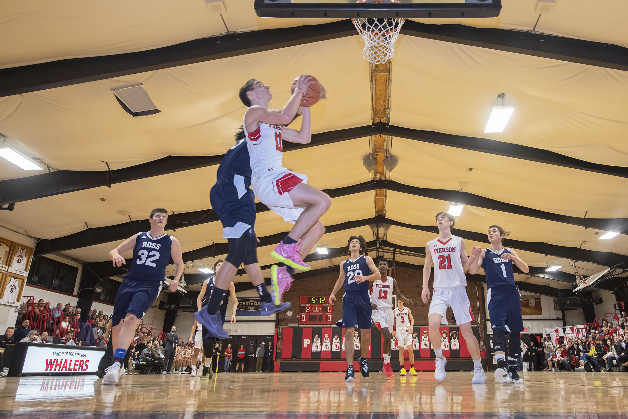 Whaler Nick Egbert is fouled while going up for a layup.