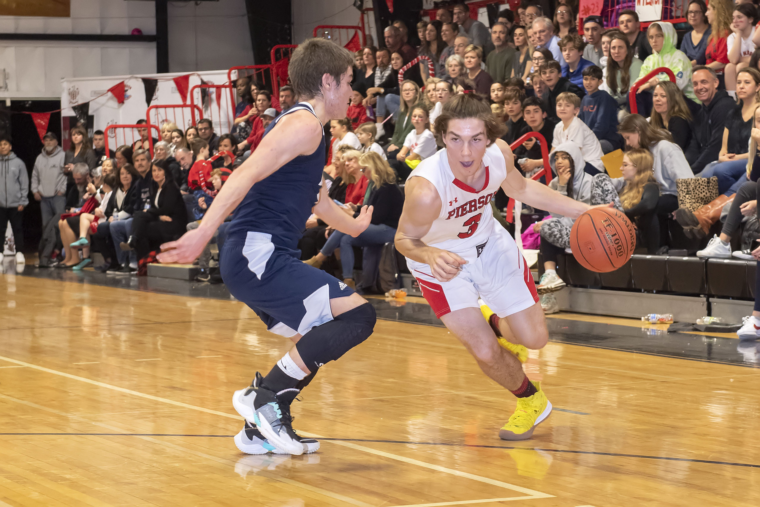 Pierson's Henry Brooks drives on a Ross defender.