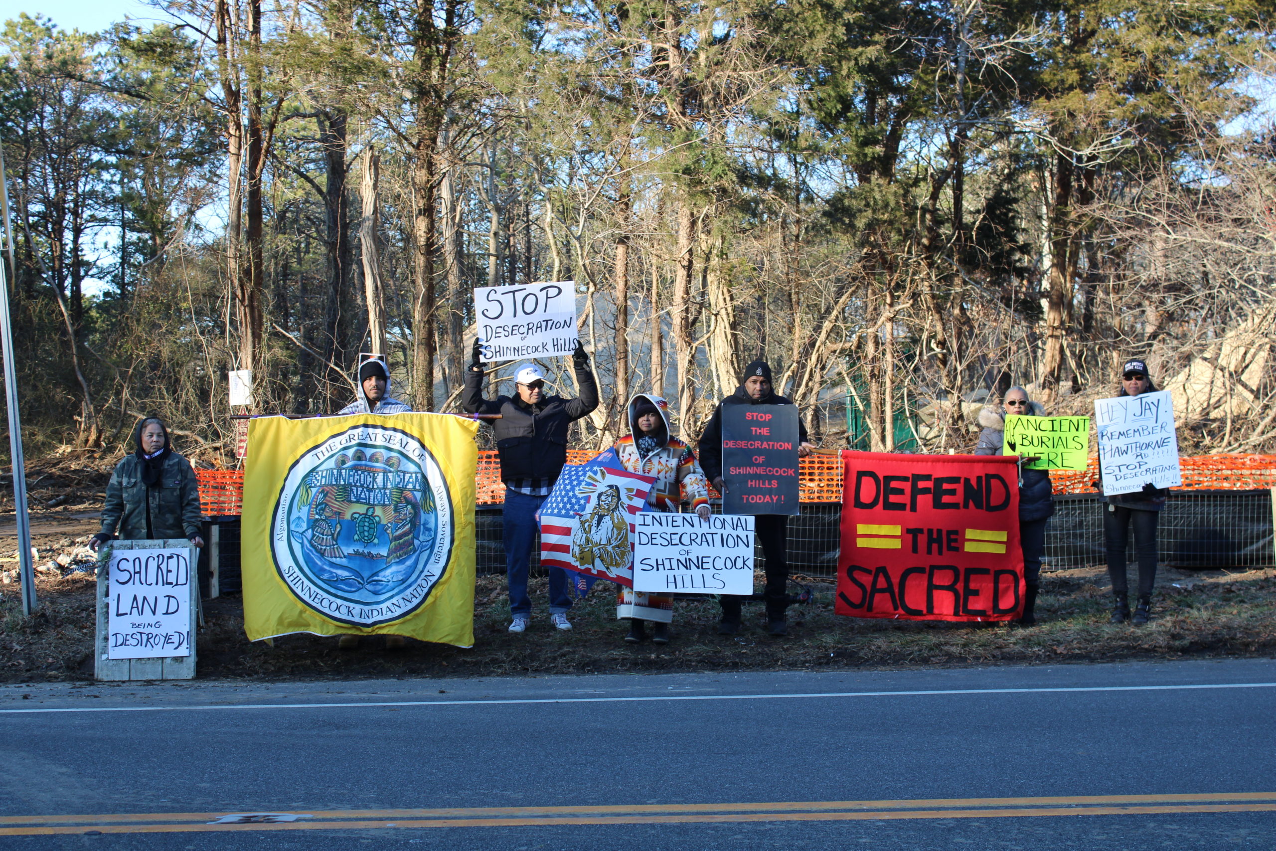 Shinnecock Tribal members gather on Montauk Highway to raise awareness about the home being built on Sugar Loaf. 