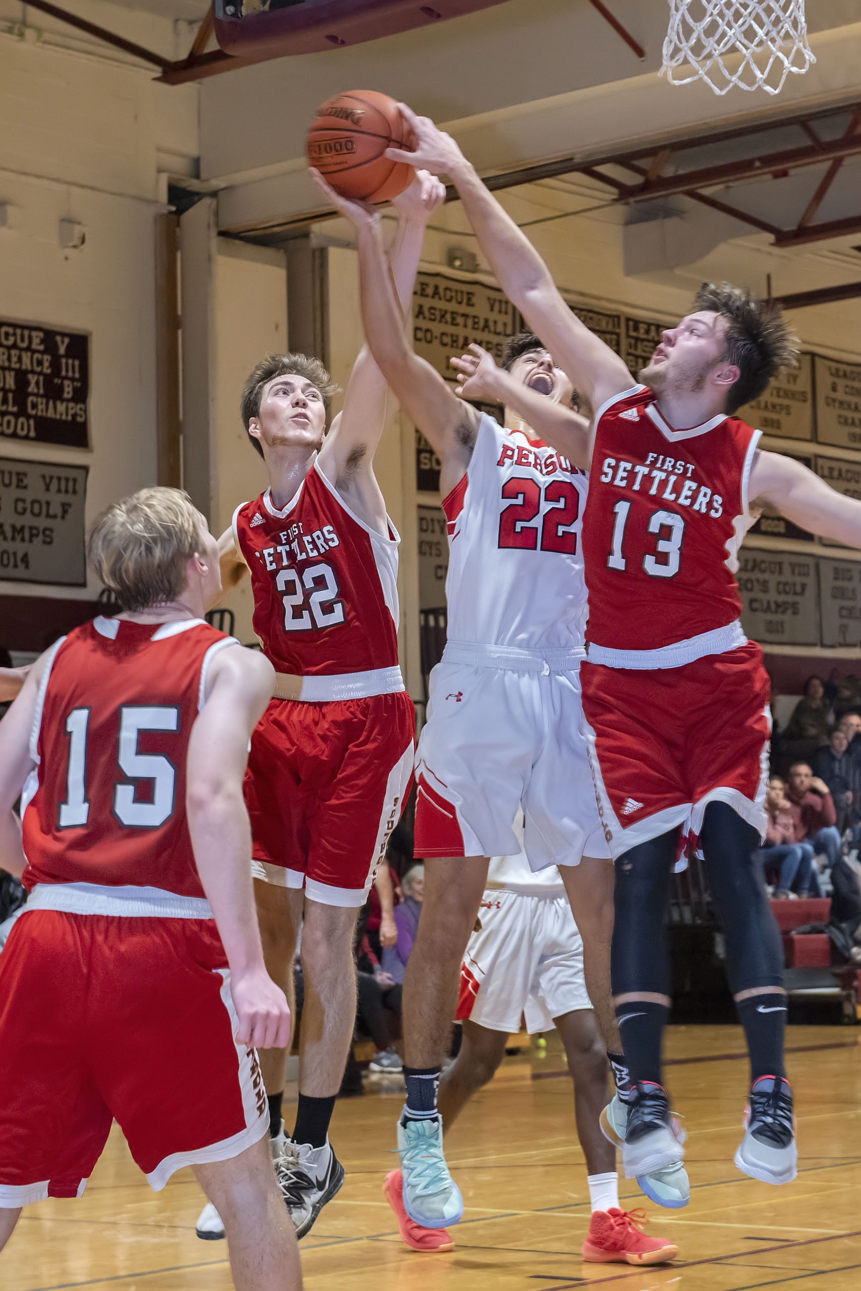 Whaler Harry Cowen is double-teamed by a pair of Southold defenders.
