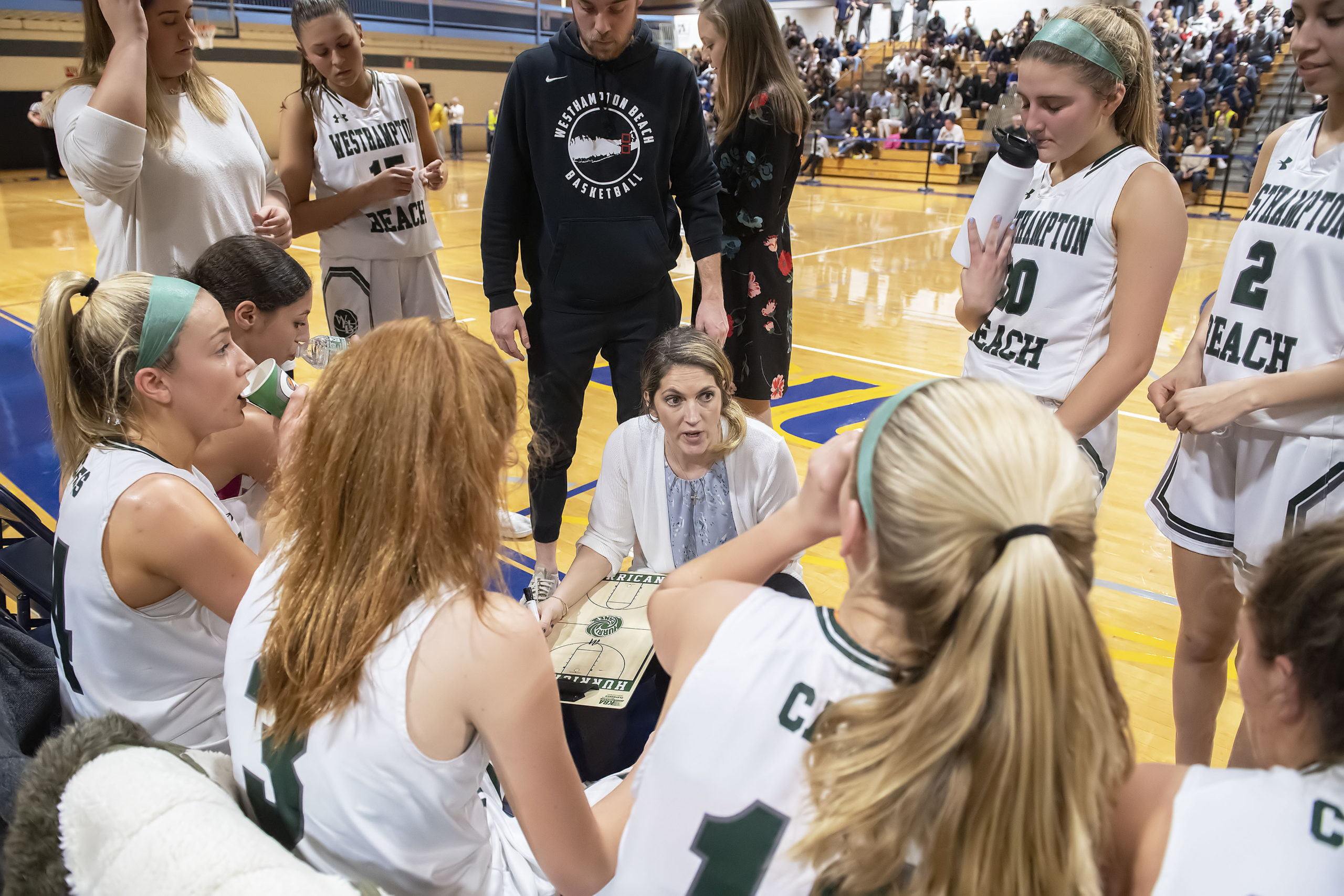 Westhampton Beach head coach Katie Peters speaks to her players on Tuesday night.